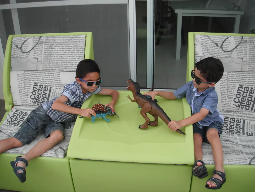 Kids playing on the Arianne outdoor sofa