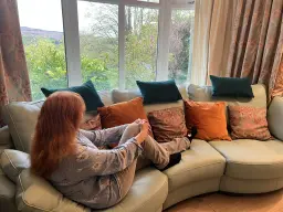 Relaxing on my beautiful sofa enjoying the beautiful view.