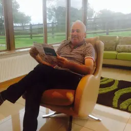 Dad Rested and Relaxed reading up on Fama