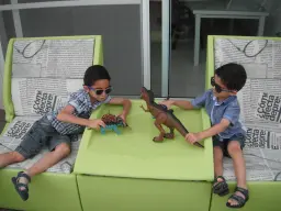 Kids playing on the Arianne outdoor sofa